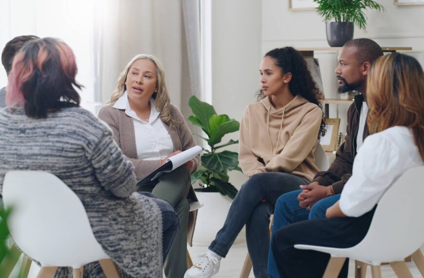 Men and women healing during psychologist meeting talking about mental health