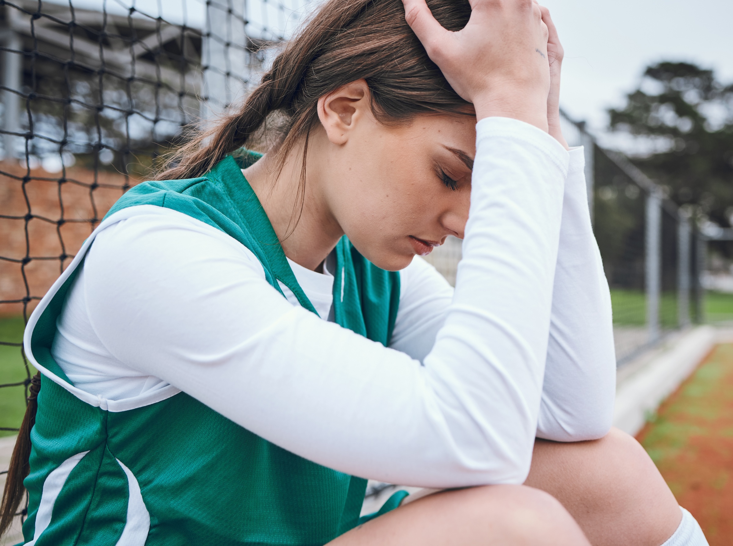 Sad, athlete and fail in sports, game or woman with stress, anxiety or frustrated with performance in competition. Match, loser and person angry with field hockey, fitness or upset with mistake.