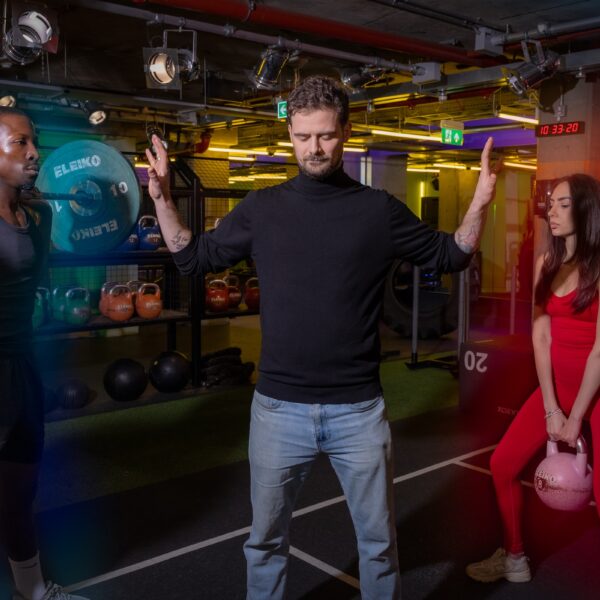 Gymbox Aura reader meditating between man and woman