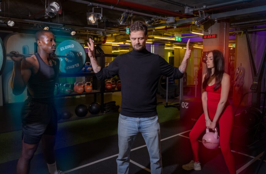 Gymbox Aura reader meditating between man and woman