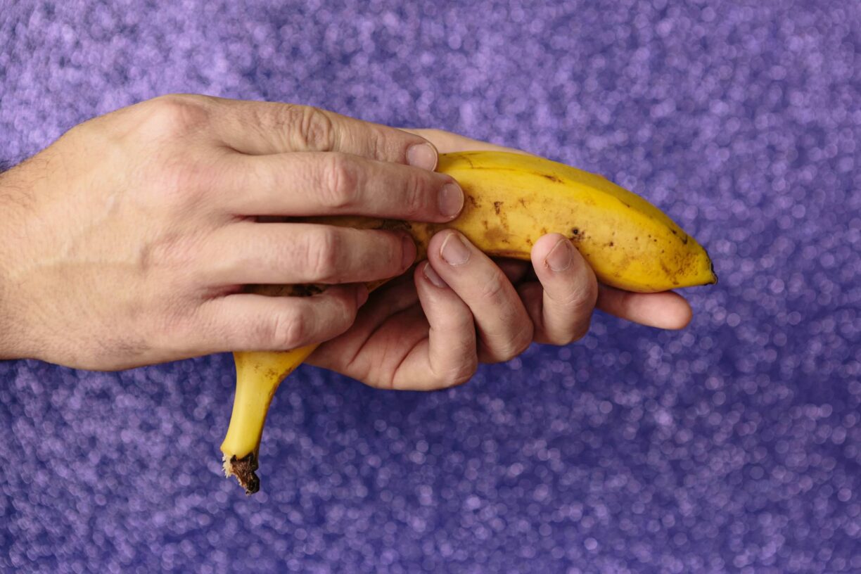 Hand holds banana