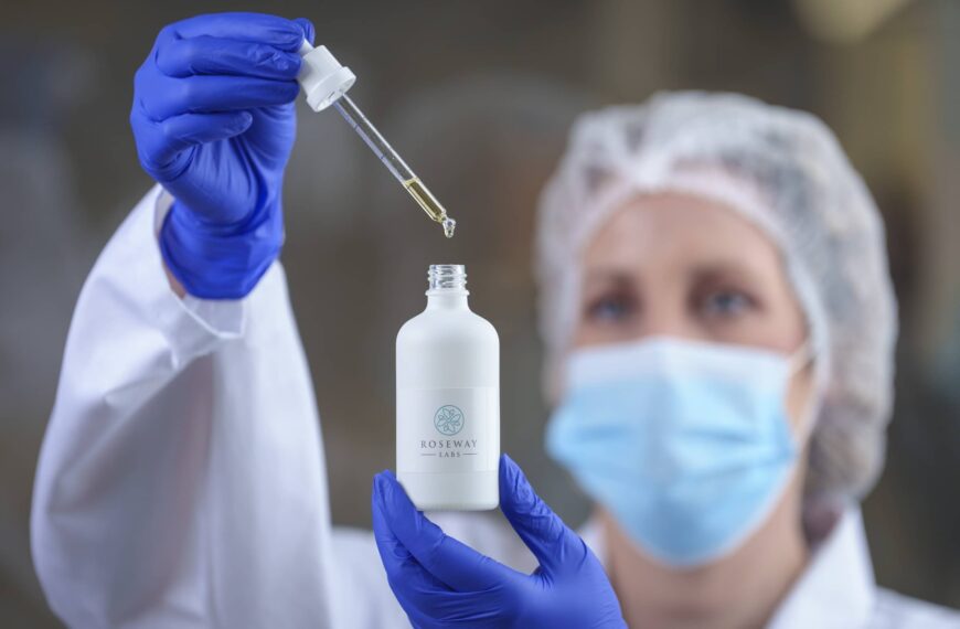 Scientist in lab mixing bottle