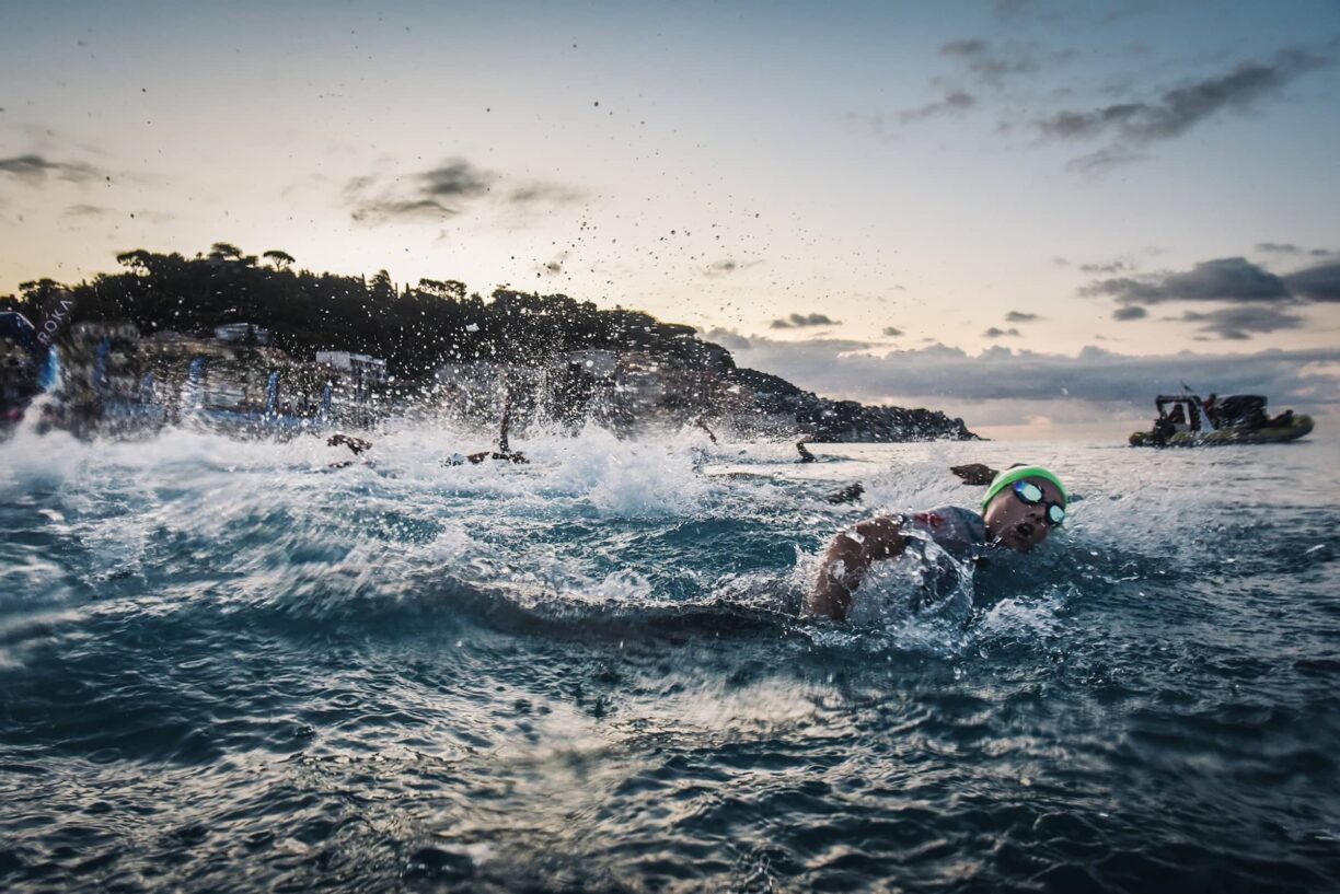 Triathletes swim in the sea