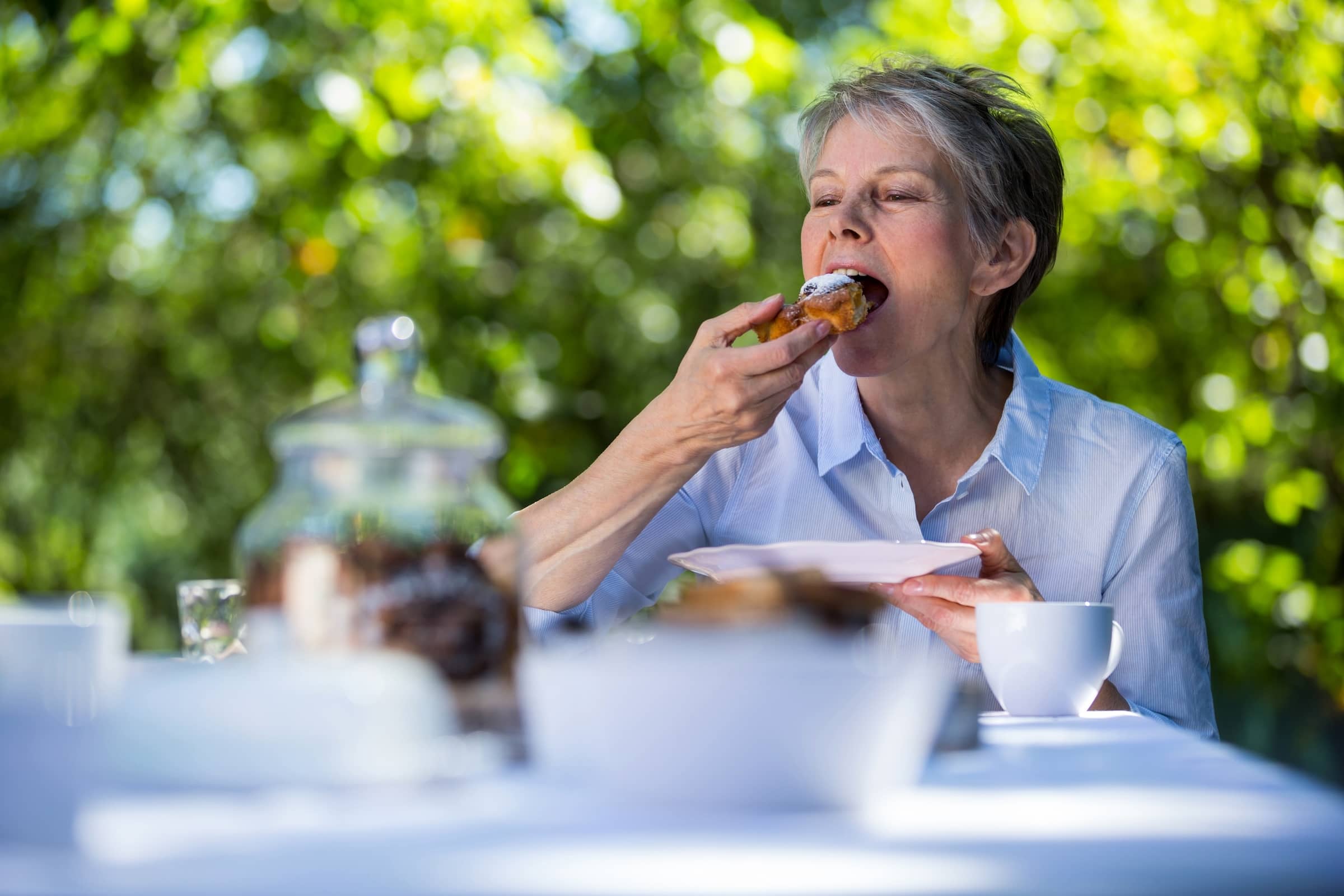 Woman bites into cake