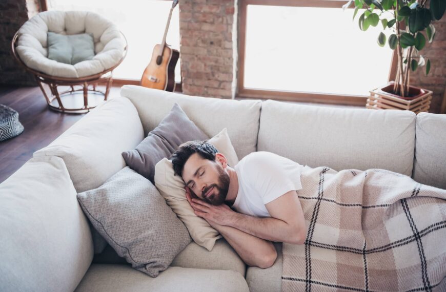 man lying on soft divan sleeping