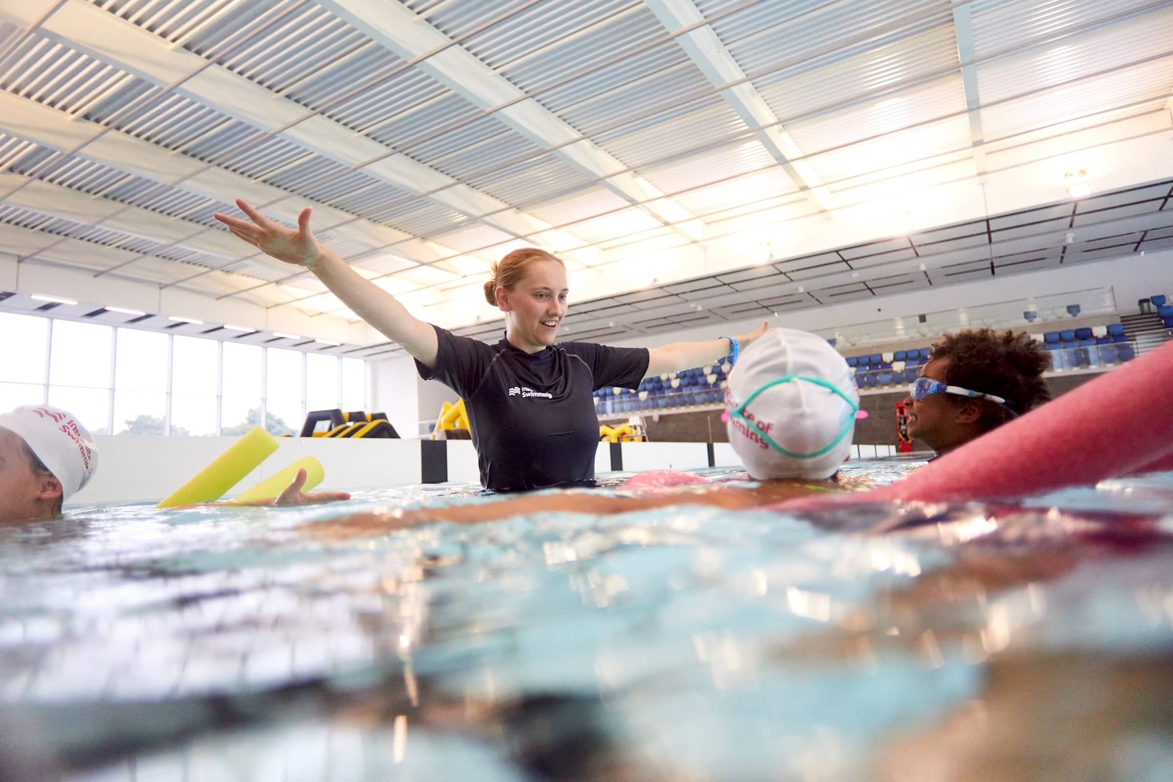 Institute of Swimming instructor teaching youngsters