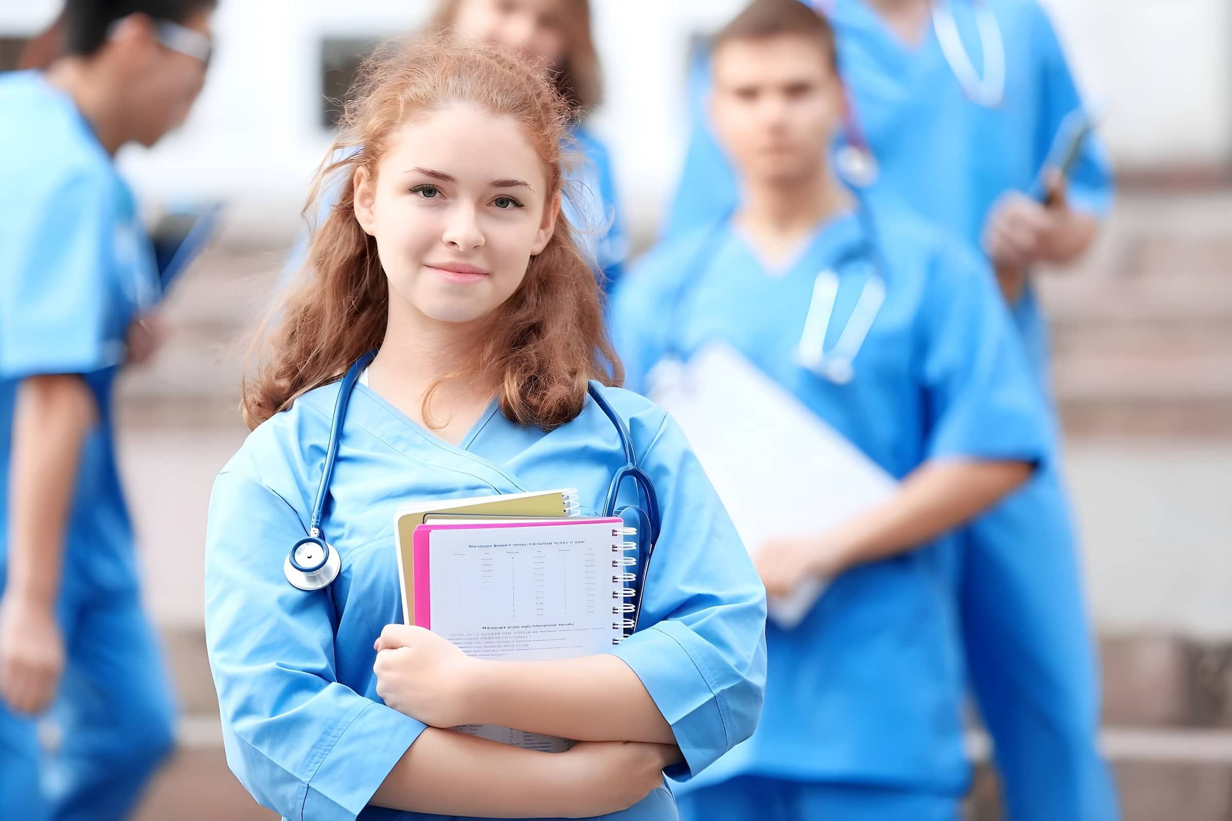 Young Nurses:Doctors on steps with study books