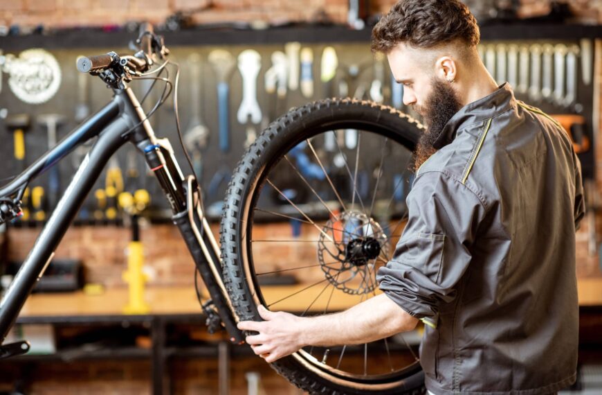 Young person maintaining a bike