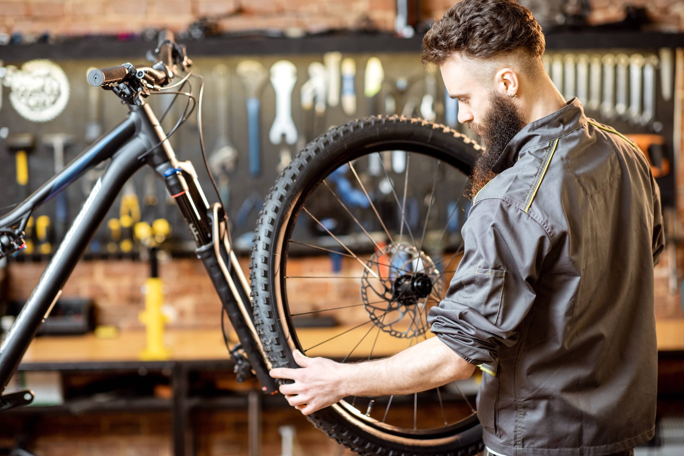 Young person maintaining a bike