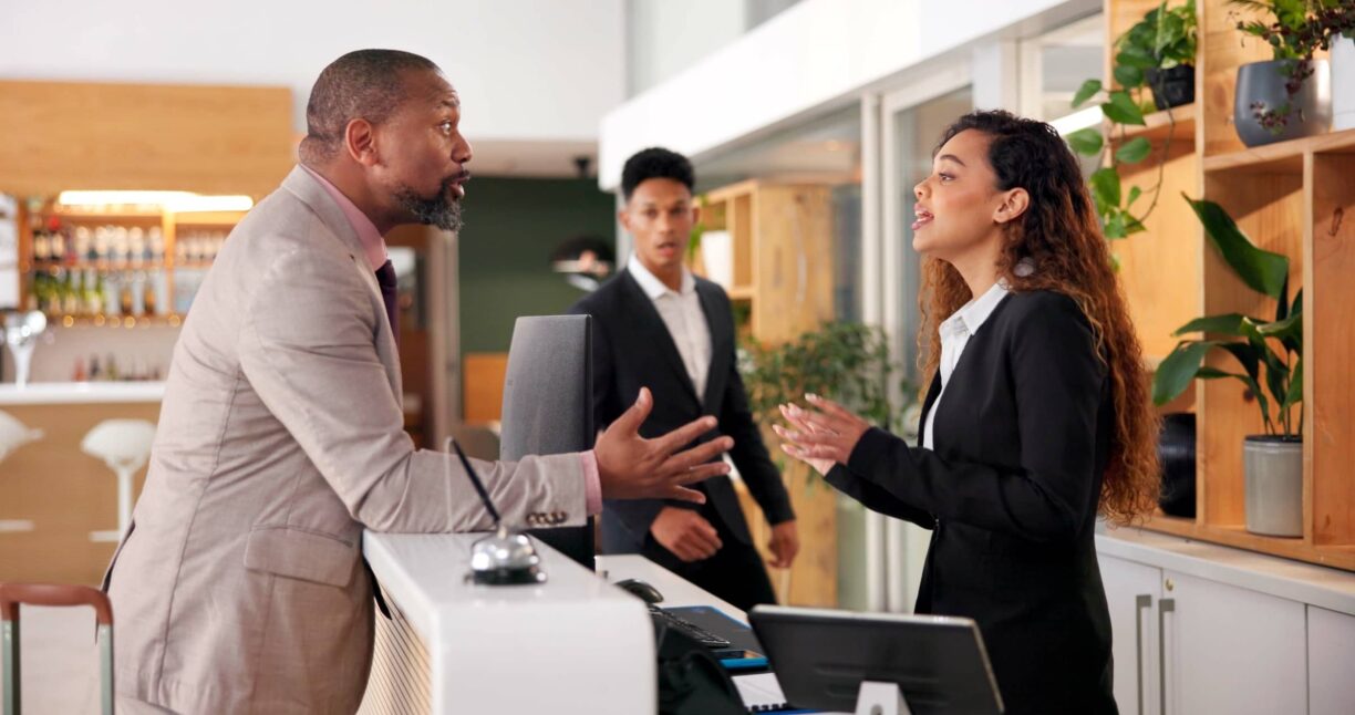 Businessman, woman angry argument for bad service at hotel