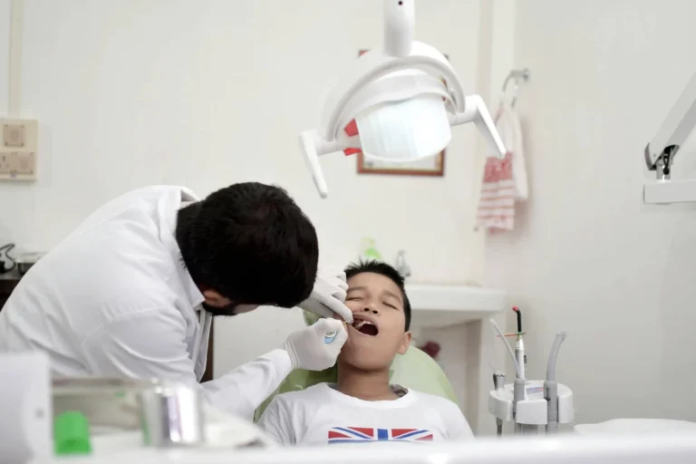 Childs teeth being examined by dentist