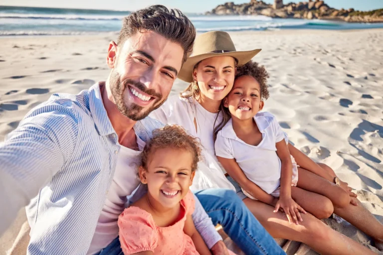 Family, selfie and kids bonding on beach in trust, safety and security summer holiday