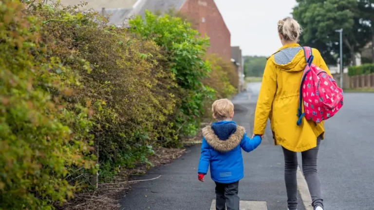 Parent and child walk together hand in hand