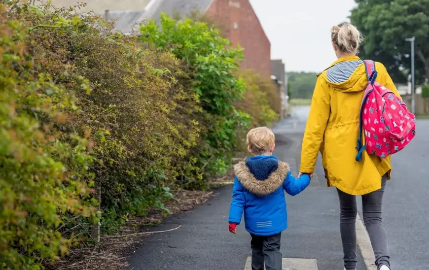 Parent and child walk together hand in hand