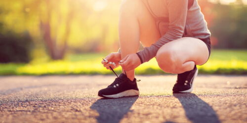 Runner ties up laces on shoes