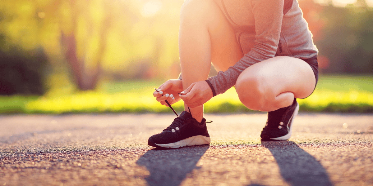 Runner ties up laces on shoes