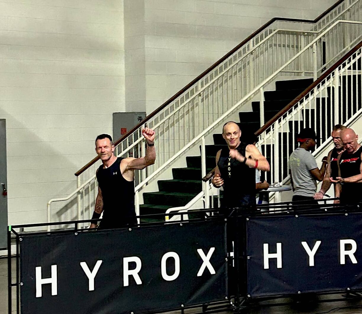 Ben and Ian wave during their HYROX Chicago Championship