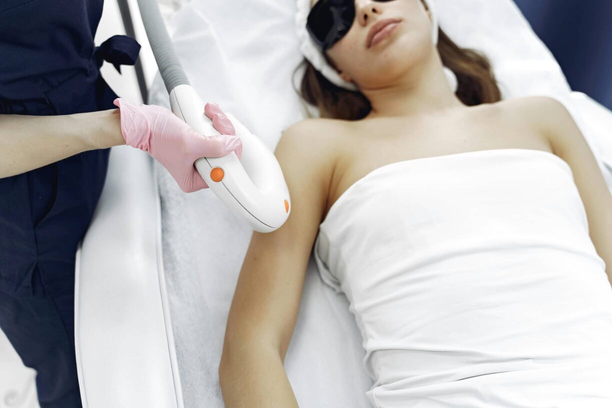 Person lays having laser hair removal