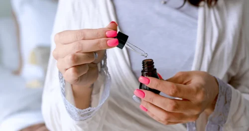 dropper bottle of collagen, cbd, serum, hyaluronic