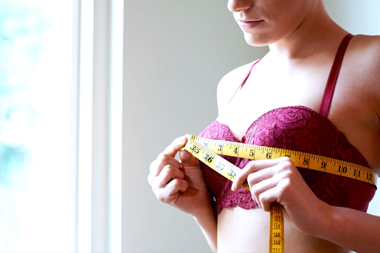Woman measures across her bra