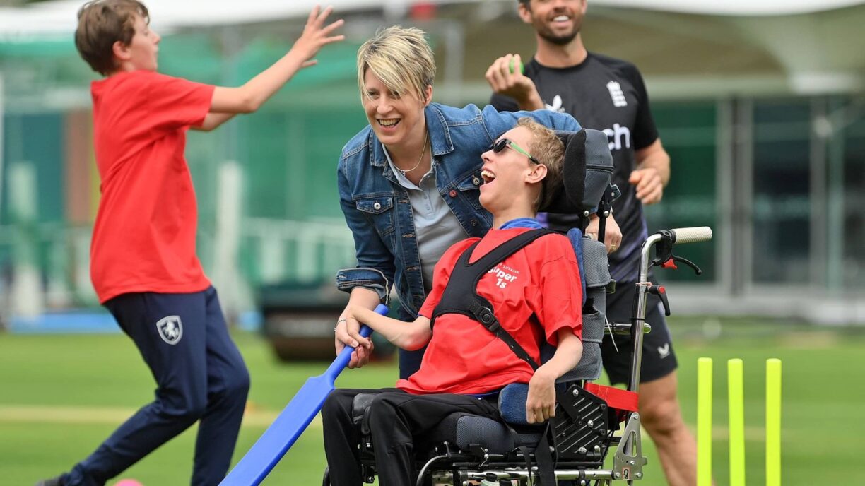 Young person in wheelchair plays cricket