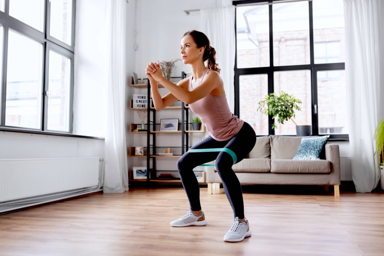 woman exercising with resistance band