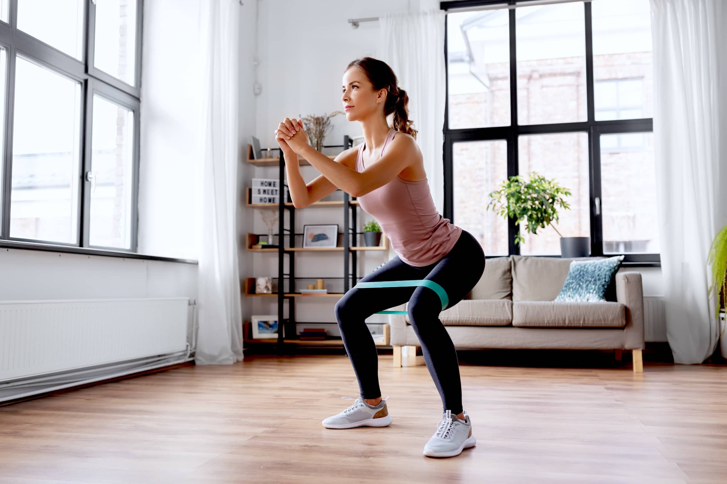 woman exercising with resistance band
