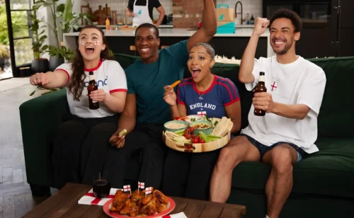 Football Fans Enjoying a Delivery of Deliveroo Food