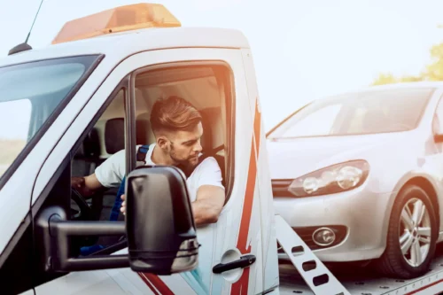 man working in towing service on the road. Roadside assistance