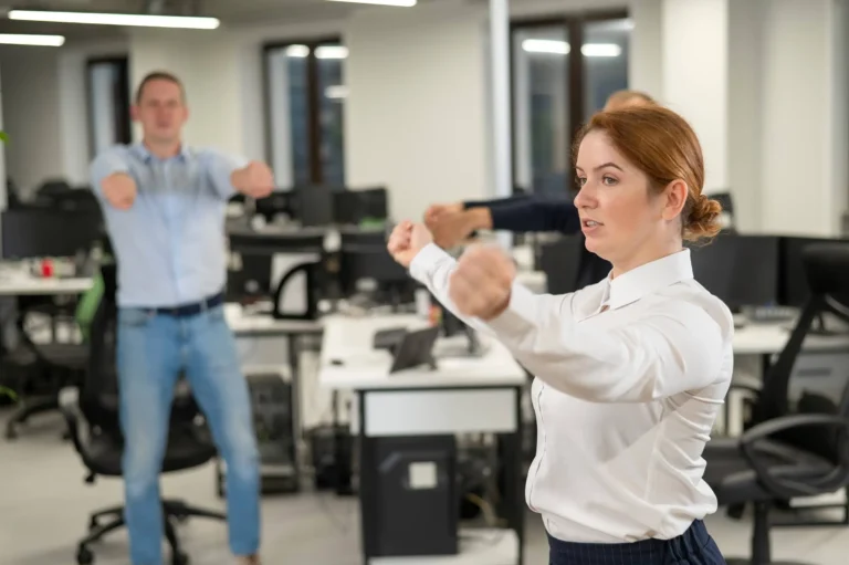 Employees do fitness exercises at the workplace