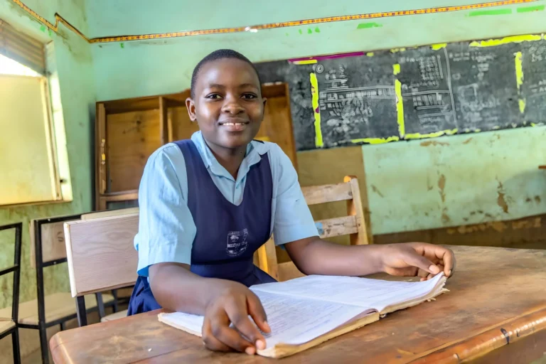 Young child in school smiles