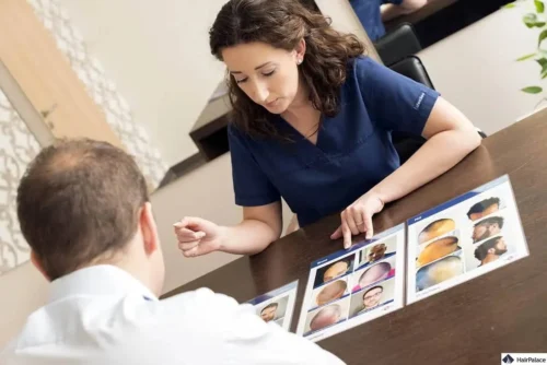 doctor discusses hair transplant cost with patient