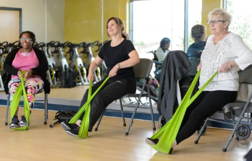 People exercise using bands