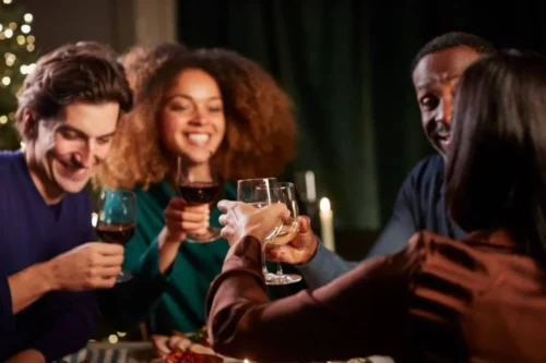 People sharing a celebration of wine