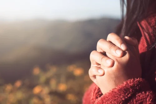 Hands placed together in faith