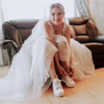 Woman wearing Wedding Dress and Sporty Shoes