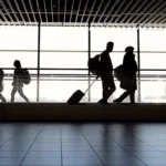 Travellers Walking through Airport Terminal
