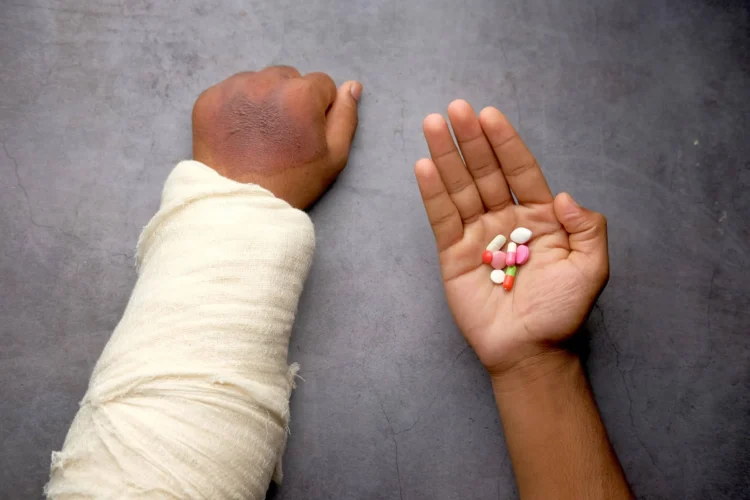 Hand holding pills