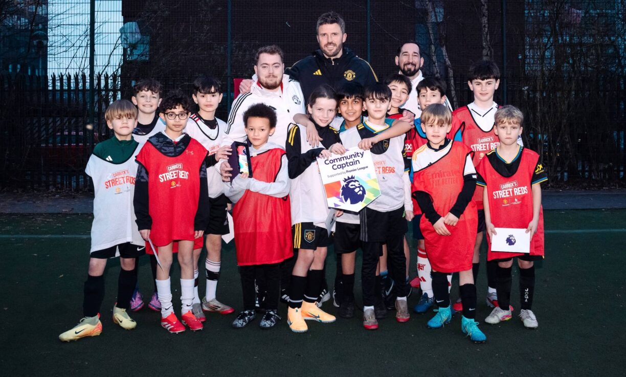 Michael Carrick PL Community Captain Mark Brent with children