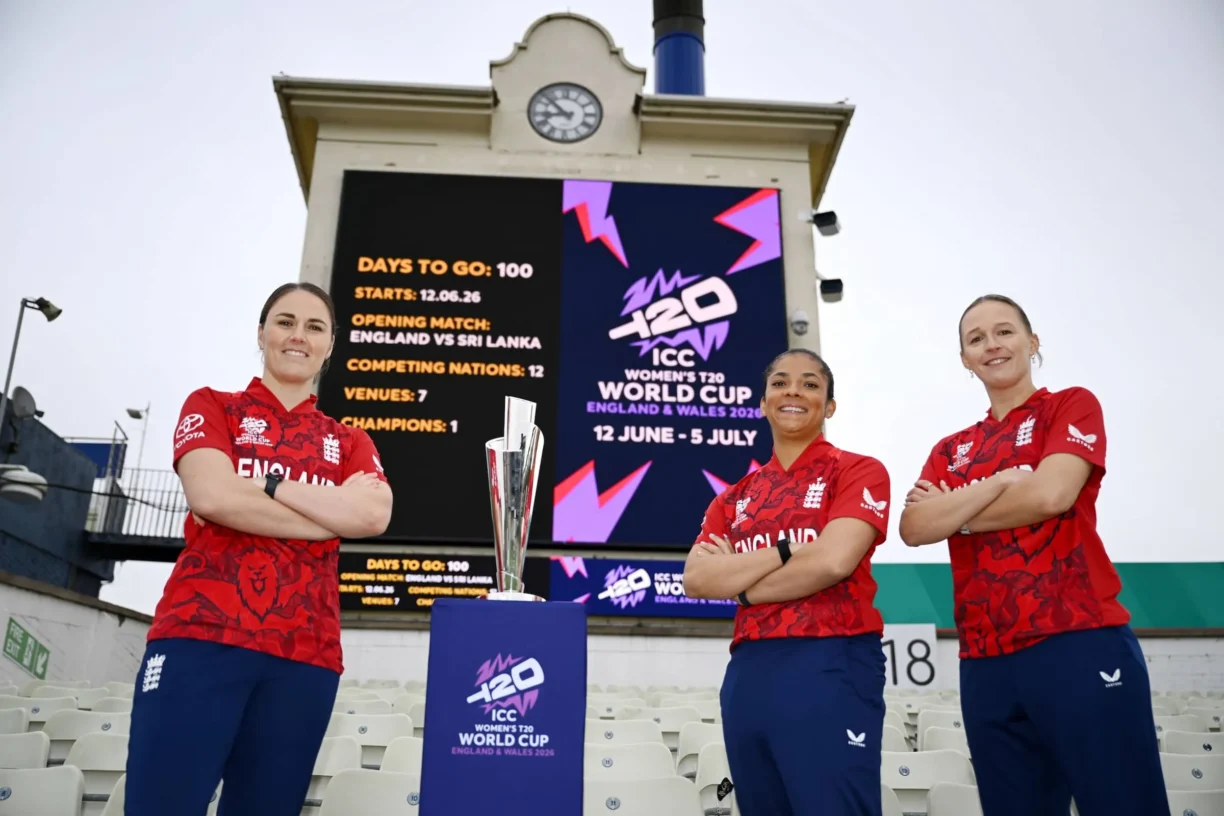 England Captain Nat Sciver-Brunt (R), Sophia Dunkley (C) of England and Lauren Filer of England pose with the ICC Women's T20 World Cup Trophy and the Edgbaston scoreboard during a media event to mark 100 Days to Go until the opening match of the ICC Women's T20 World Cup, at Edgbaston