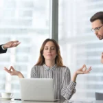 Calm female managing stress at workplace