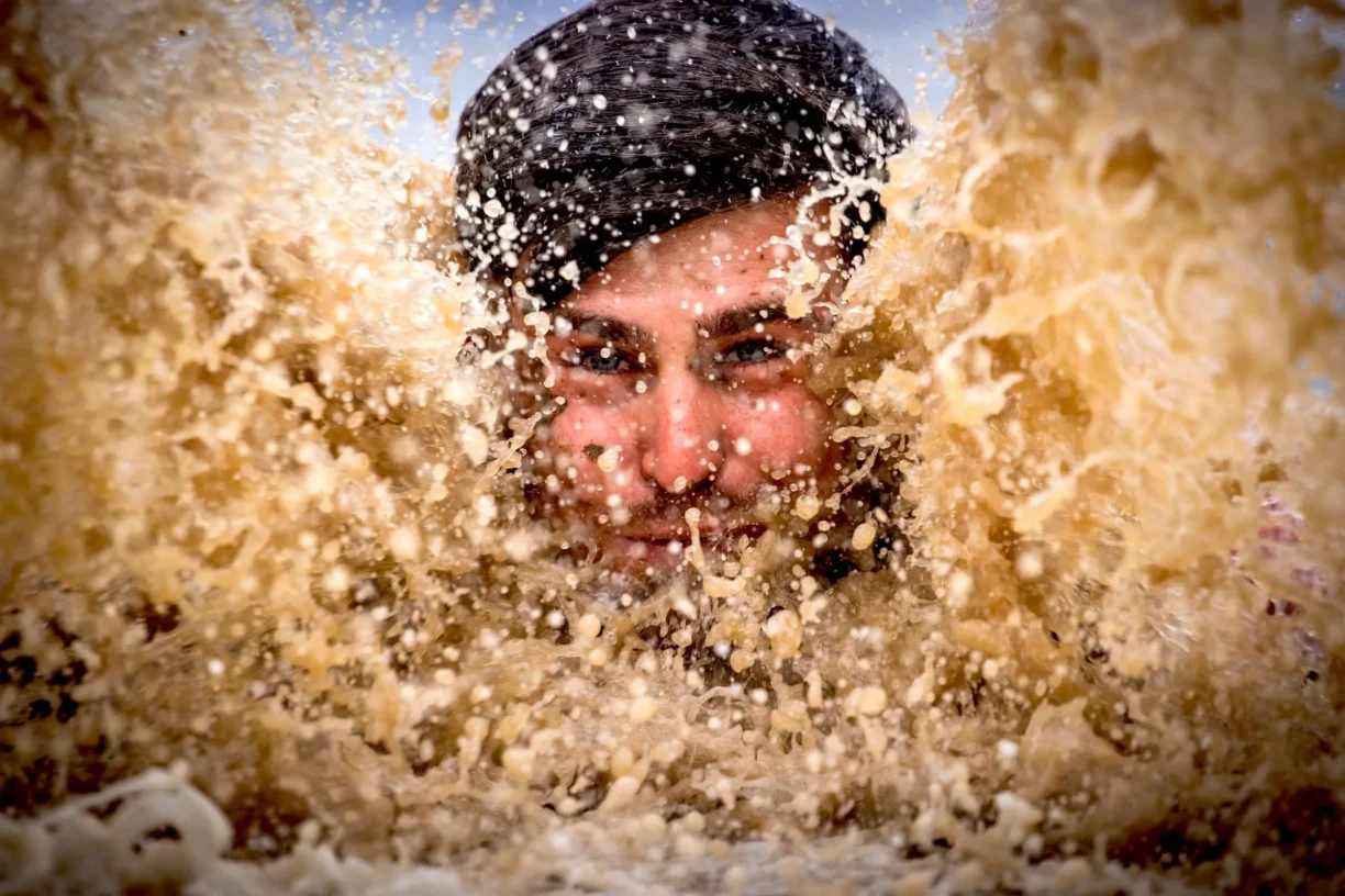 Wolf Run Participant in muddy water