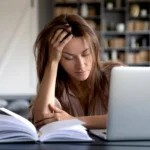 Woman tired at laptop