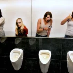 Women making fun of men in toilet