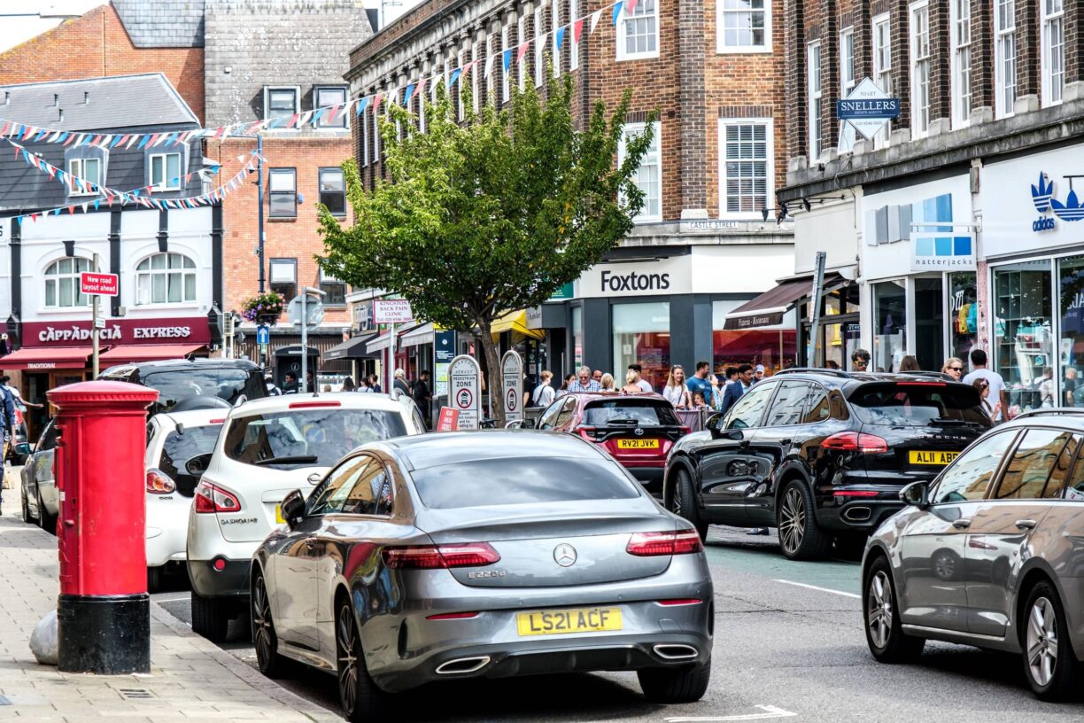 Cars Parked Along Main Street Shopping Area