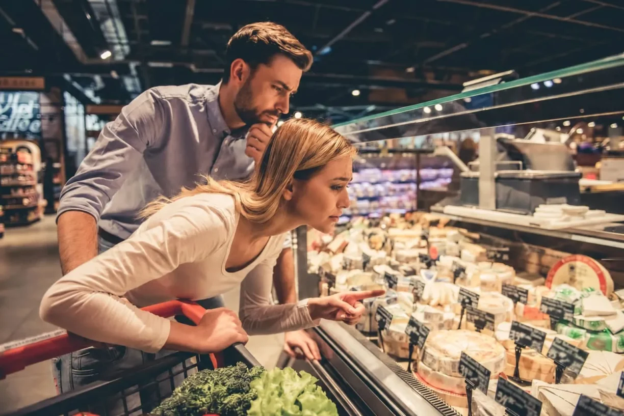 Couple look anxious in supermarket