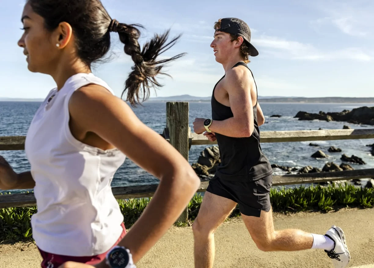 Runners wearing the Forerunner 70 and 170