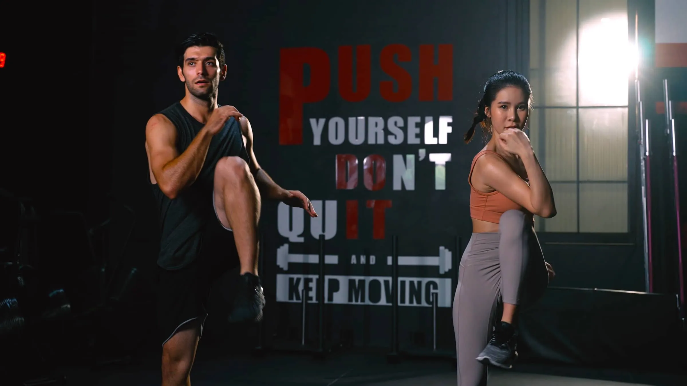 Sporty Couple Cardio Exercise Burning Calorie HIIT and Squat in Fitness Gym