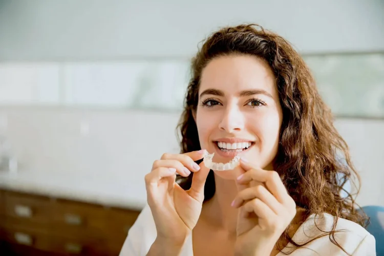 Woman with dental aligners
