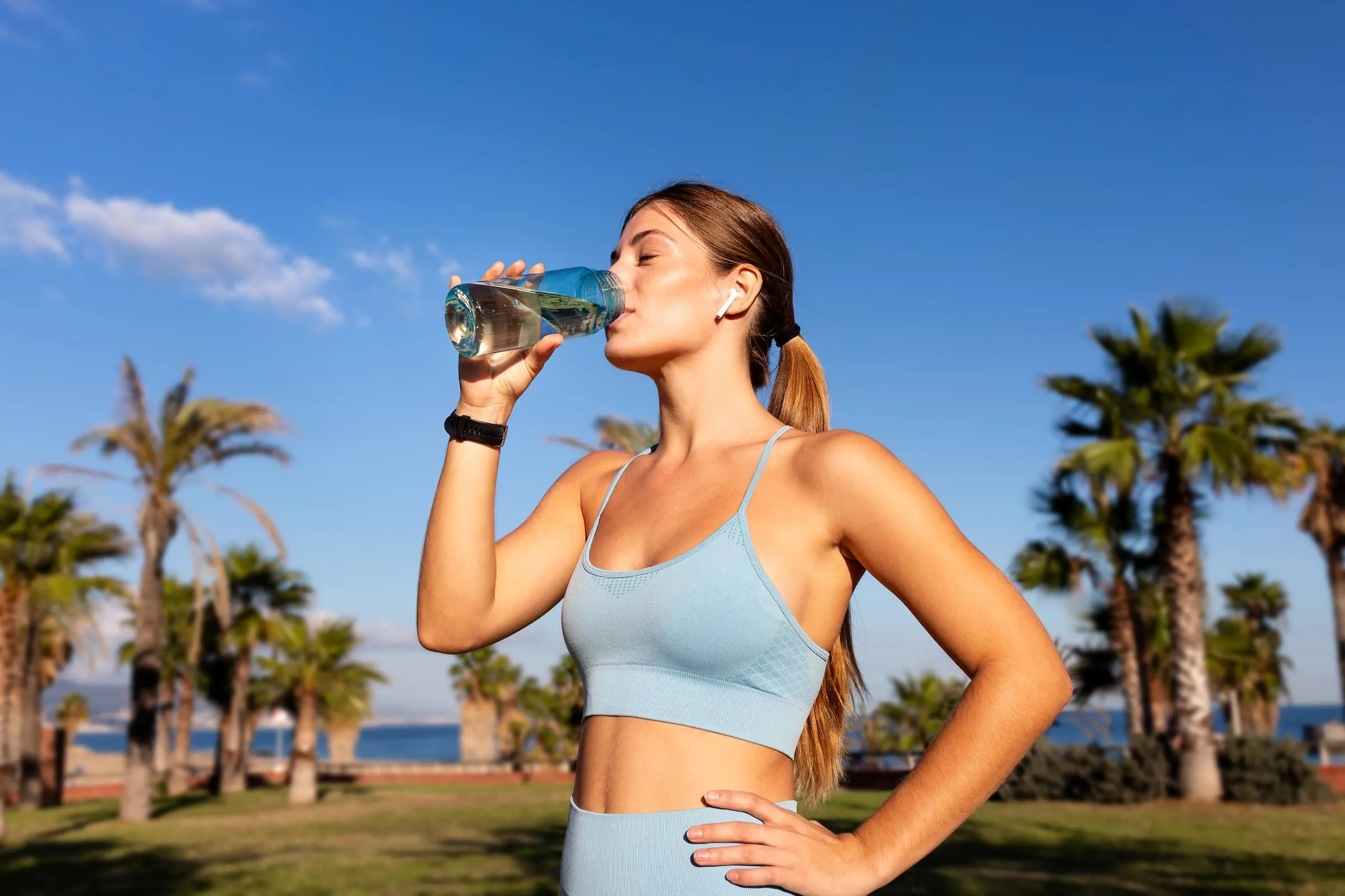 woman drinking water summer health